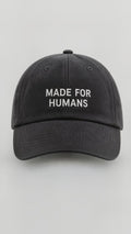 MADE FOR HUMANS cap in Black — front, wordmark embroidery