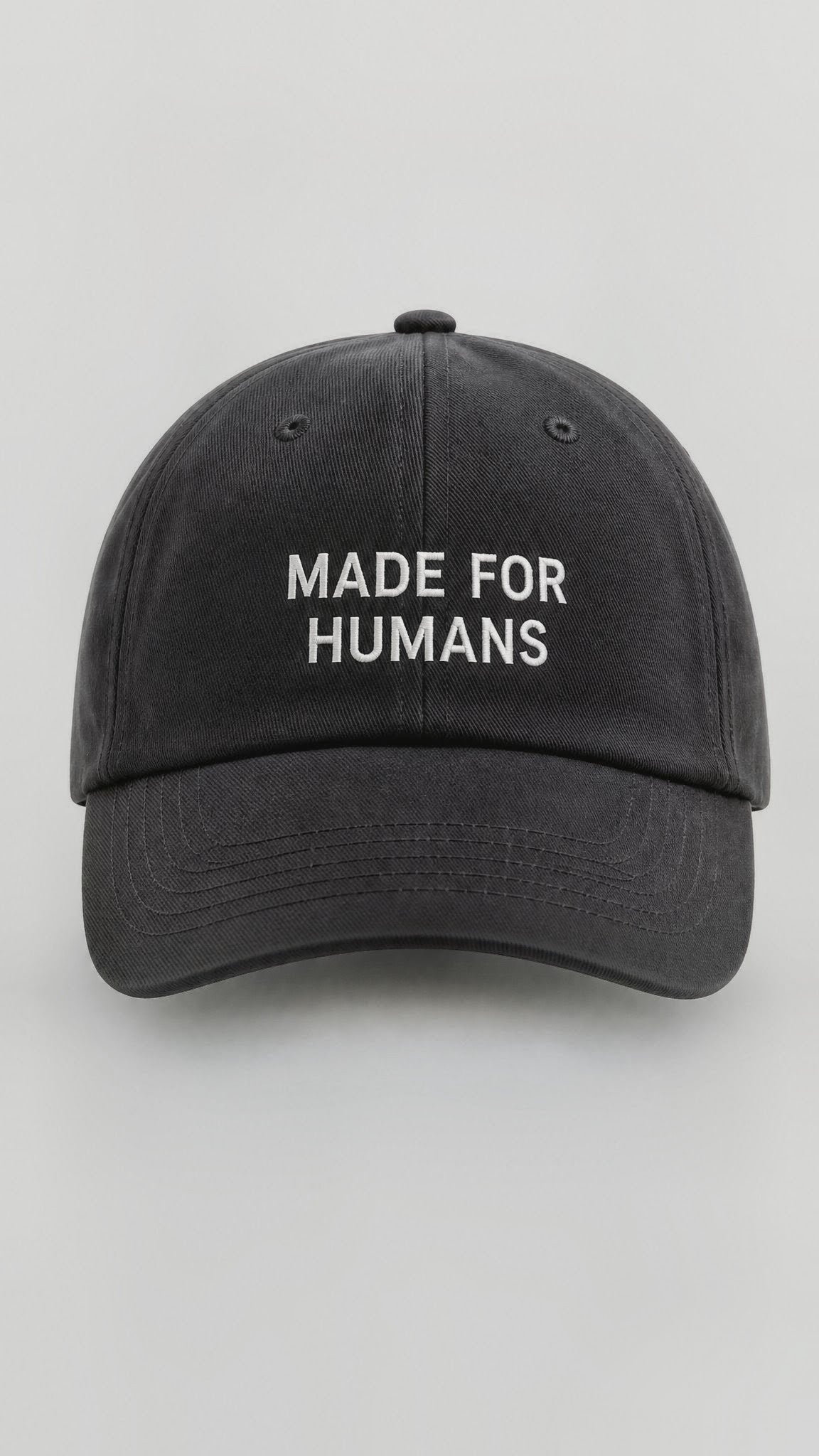 MADE FOR HUMANS cap in Black — front, wordmark embroidery
